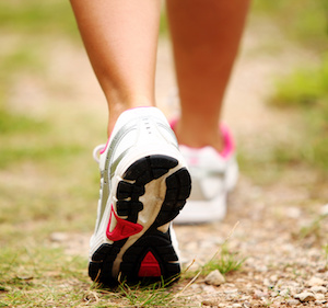 Female legs jogging on a trail